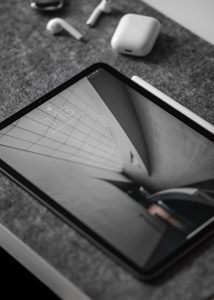 Black iPad on a gray surface