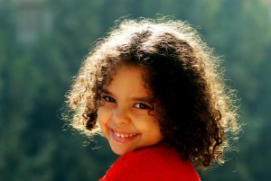 Child with short, curly hair