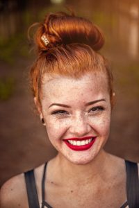 Smiling person with red hair