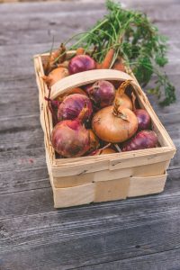 Basket of onions and carrots