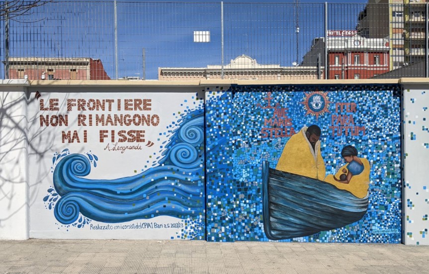 Street art representing two migrants on a boat