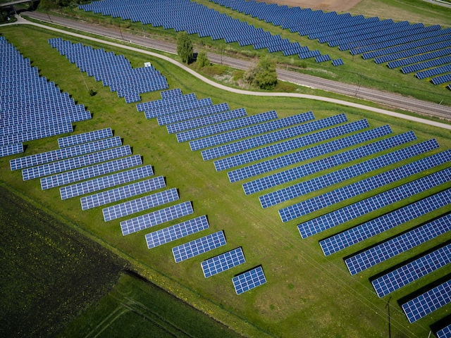 A green field covered by solar panels