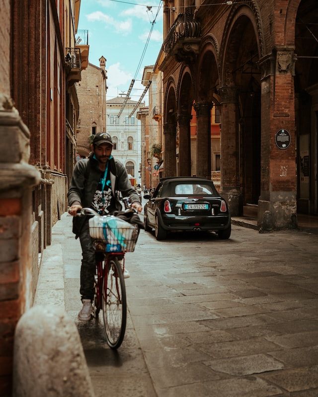 A picture of a man riding his bike in Bologna