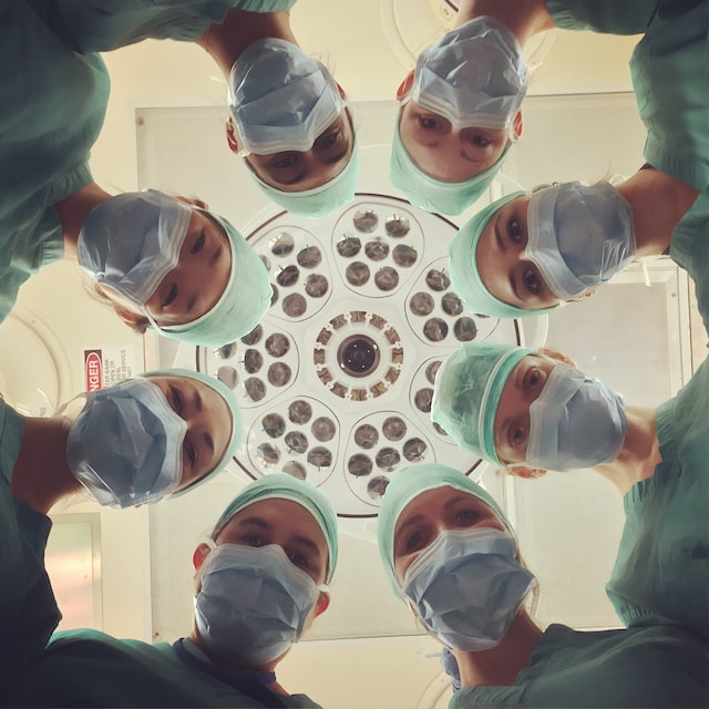 A picture of seven nurses in the surgery room