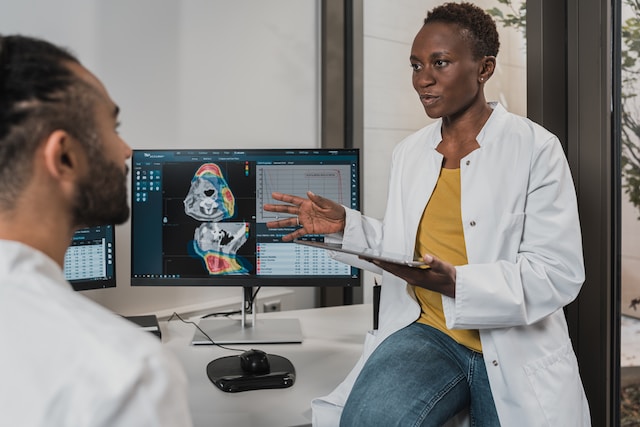 A woman doctor showing results to a colleague