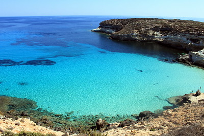 Rocky coast against a clear, blue sea