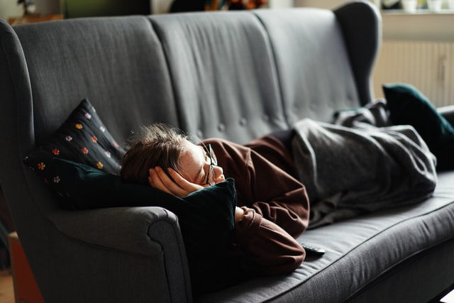 Person resting on a couch