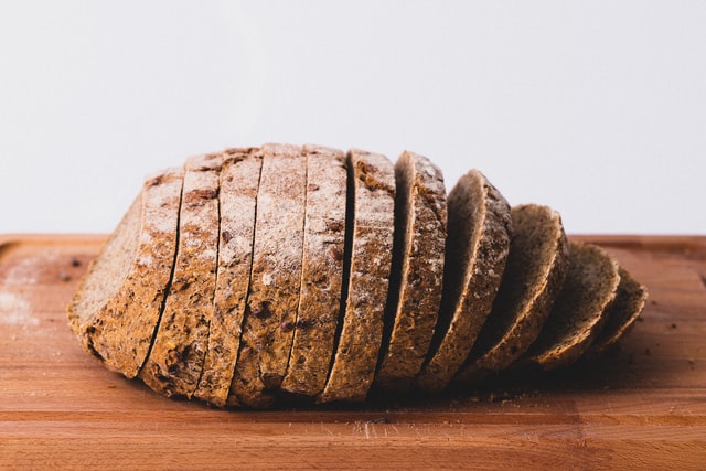 A sliced loaf of whole wheat bread