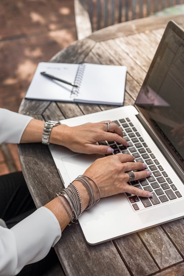 Person typing on a laptop