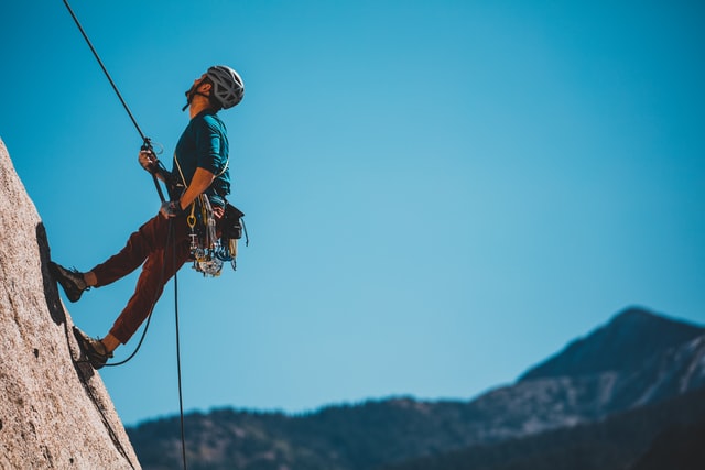 Man climbing a mountain