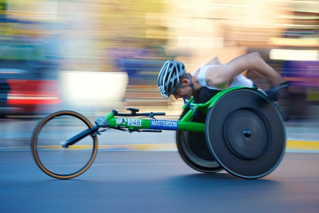 Man competing in a wheelchair marathon race