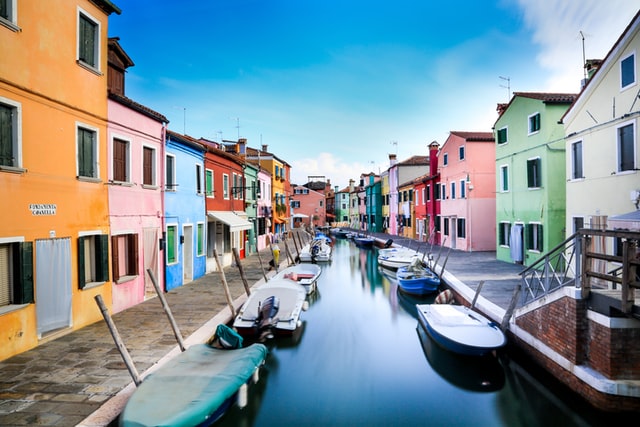 Small port in a canal between colorful houses