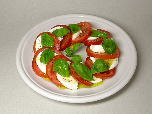 Tomato, mozzarella, basil in a circle on a plate