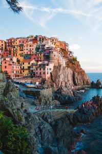 Colorful homes on a mountain adjacent to the sea