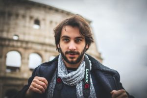 Person in front of colosseum