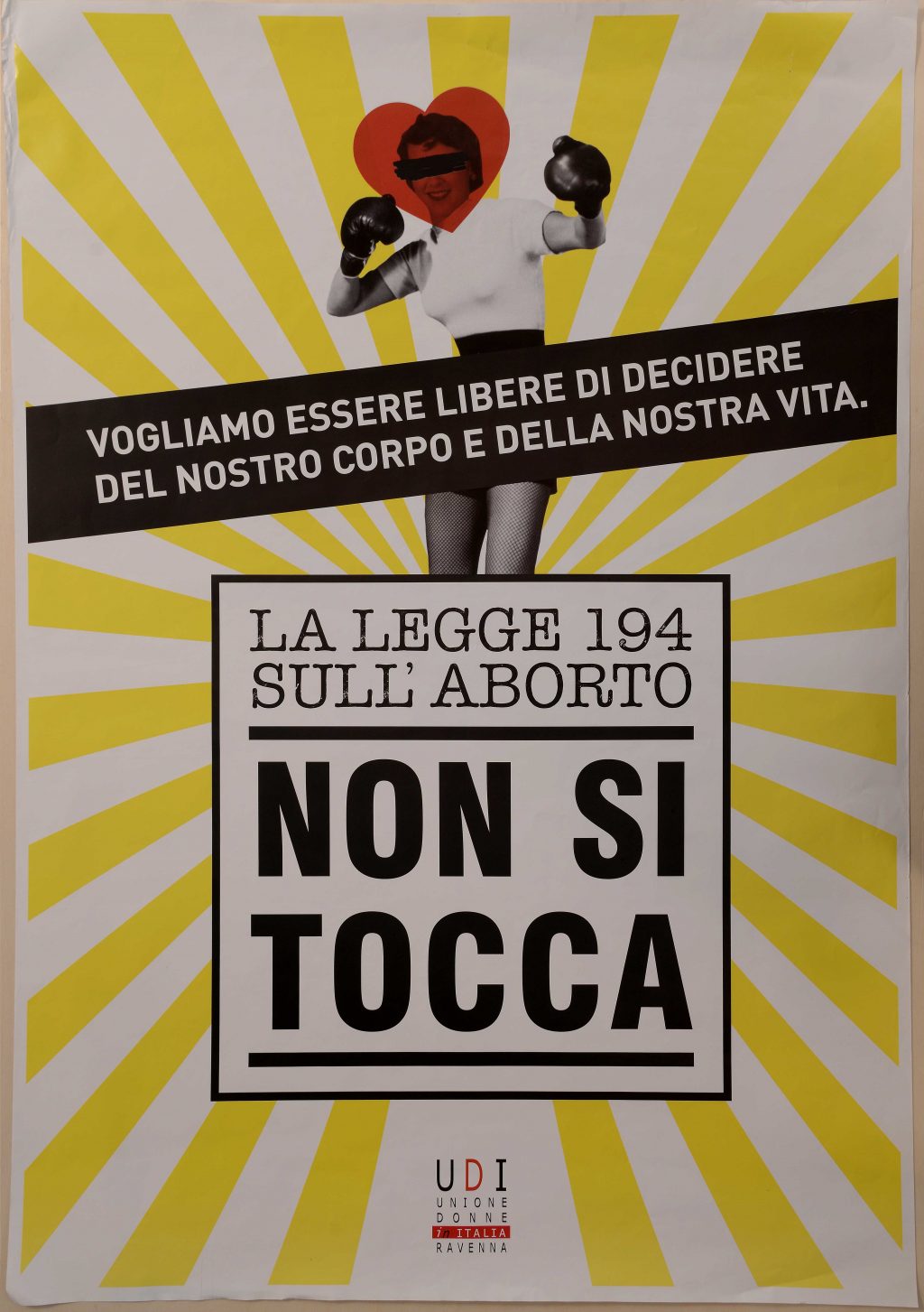 An Italian flyer from the 1970s with a boxing woman who is fighting for her abortion right