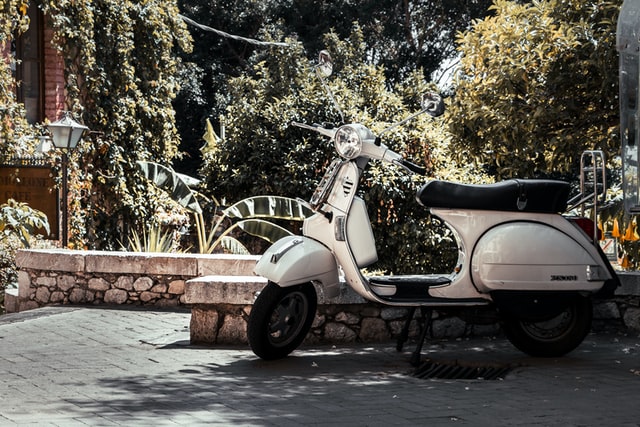 Vespa parked in a driveway