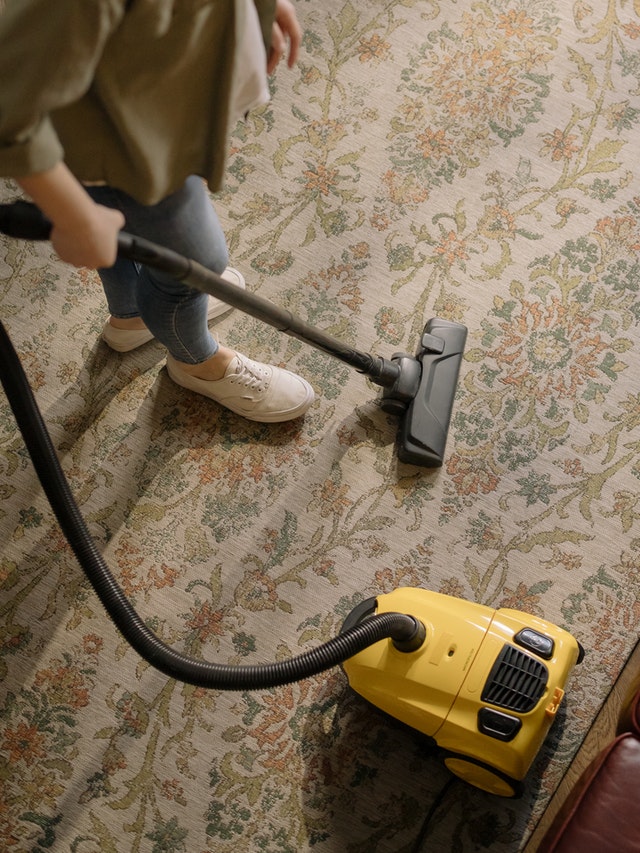 Person vacuuming