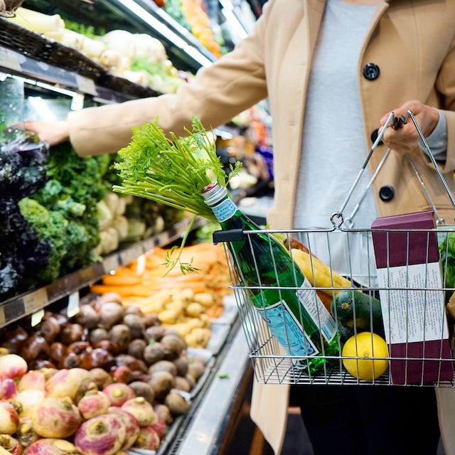 A person buying veggies at the supermarket