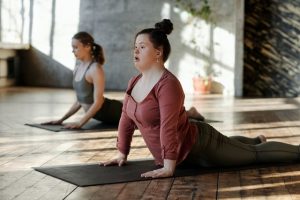 Two people doing yoga