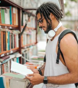 Man looking at a book at a bookstore