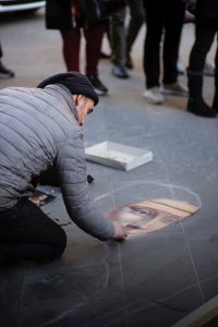 Person making street art